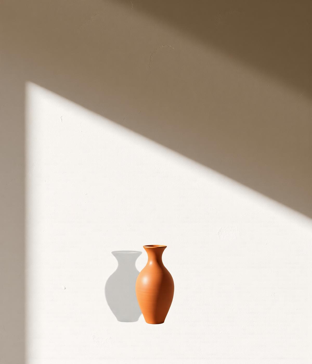 A single terracotta vase casting a long shadow